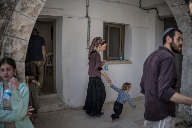 Israeli settlers gather during the resettlement ceremony of Sa-Nur, south of Jenin in the Israeli-occupied West Bank, on April 19, 2026. Israeli ministers on April 19 officially reopened Sa-Nur, a settlement in the occupied West Bank that was evacuated 20 years ago, marking the occasion with defiant declarations against Palestinian statehood and calls to resettle Gaza. (Photo by MARCO LONGARI / AFP)