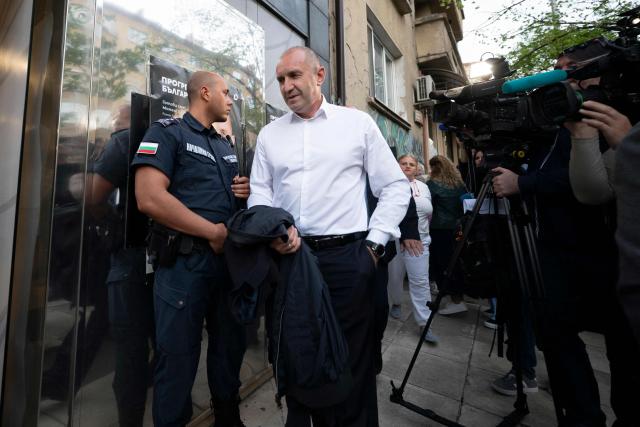 "Progressive Bulgaria" coalition's leader and former President Rumen Radev arrives at his party headquarters after polls closed in Bulgaria's parliamentary elections in Sofia on April 19, 2026. Bulgaria held its eighth legislative election in five years, with ex-president Rumen Radev's grouping tipped to win on a pledge to fight corruption, after an anti-graft movement triggered a long political crisis. (Photo by Dimitar KYOSEMARLIEV / AFP)