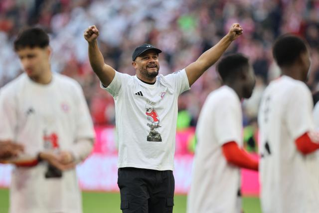 Bayern Munich's Belgian head coach Vincent Kompany celebrates after the German first division Bundesliga football match between FC Bayern Munich and VfB Stuttgart in Munich, southern Germany, on April 19, 2026. Harry Kane scored his 32nd goal of the campaign as Bayern Munich cruised to a 4-2 home win over Stuttgart and claim a record-extending 35th Bundesliga title. (Photo by Alexandra BEIER / AFP) / DFL REGULATIONS PROHIBIT ANY USE OF PHOTOGRAPHS AS IMAGE SEQUENCES AND/OR QUASI-VIDEO