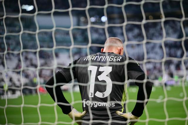 Juventus' Italian goalkeeper #16 Michele Di Gregorio wears the jersey of late former Juventus goalkeeper Alex Manninger during the warm up upon the Italian Serie A football match between Juventus and Bologna at the Allianz stadium in Turin, on April 19, 2026. (Photo by Marco BERTORELLO / AFP)