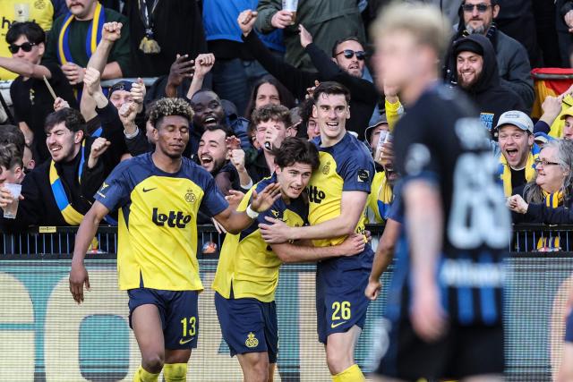 Royale Union Saint-Gilloise's Swedish forward #23 Besfort Zeneli (C) celebrates with teammates after scoring a goal during the third day of the Champion's Play-offs of the 2025-2026 Belgian championship Pro League first division football match between oyale Union Saint-Gilloise (RUSG) and Club Brugge, in Brussels on April 19, 2026. (Photo by BRUNO FAHY / Belga / AFP) / Belgium OUT