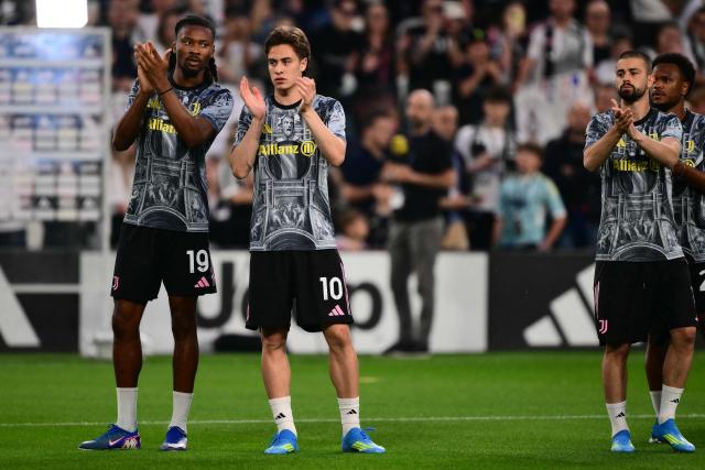 Juventus' Turkish forward #10 Kenan Yildiz and Juventus' French midfielder #19 Khephren Thuram-Ulien greet supporters before the Italian Serie A football match between Juventus and Bologna at the Allianz stadium in Turin, on April 19, 2026. (Photo by Marco BERTORELLO / AFP)
