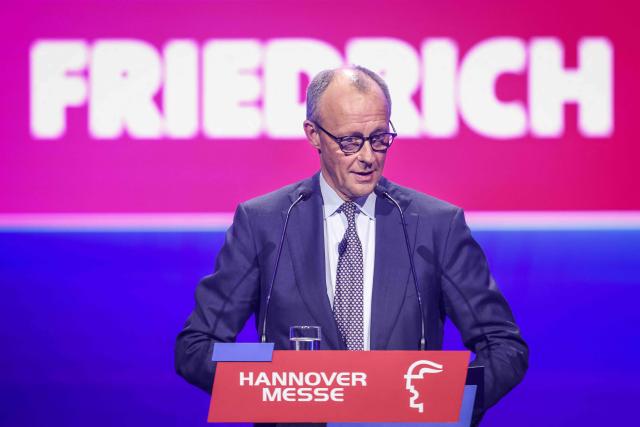 German Chancellor Friedrich Merz delivers a speech during the opening gala of the Hanover industrial trade fair for mechanical and electrical engineering and digital industries, in Hanover, northern Germany on April 19, 2026. The fair opens its doors to the public on April 20 and will be running until April 24, 2026. (Photo by Ronny HARTMANN / AFP)