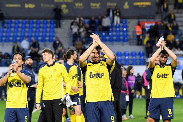 Royale Union Saint-Gilloise's players celebrate following the third day of the Champion's Play-offs of the 2025-2026 Belgian championship Pro League first division football match between oyale Union Saint-Gilloise (RUSG) and Club Brugge, in Brussels on April 19, 2026. (Photo by JILL DELSAUX / Belga / AFP) / Belgium OUT