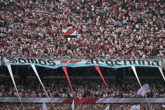 A flag reading "We are Argentina" and featuring a map of the Falkland Islands is displayed on the stands ahead of the Argentine Professional Football League 2026 Apertura tournament match between River Plate and Boca Juniors at the Mas Monumental stadium in Buenos Aires on April 19, 2026. (Photo by JUAN MABROMATA / AFP)