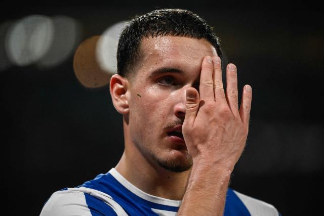 FC Porto's Turkish forward #27 Deniz Gul wipes his forehead during the Portuguese League football match between FC Porto and CD Tondela at Dragao stadium in Porto on April 19, 2026. (Photo by Miguel RIOPA / AFP)