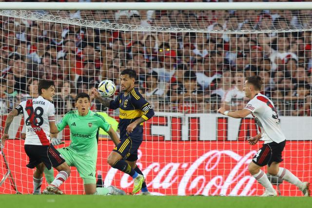 Boca Juniors' midfielder #05 Leandro Paredes (C) controls the ball past River Plate's defender #28 Lucas Martinez Quarta (L) and midfielder #34 Giuliano Galoppo (R) during the Argentine Professional Football League 2026 Apertura Tournament match between River Plate and Boca Juniors at MAS Monumental stadium in Buenos Aires on April 19, 2026. (Photo by Alejandro PAGNI / AFP)