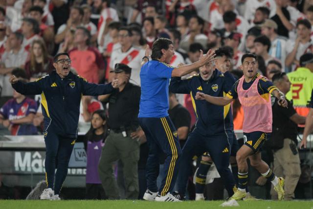 Boca Juniors' head coach Claudio Ubeda (C) celebrates after winning the Argentine Professional Football League 2026 Apertura Tournament match between River Plate and Boca Juniors at MAS Monumental stadium in Buenos Aires on April 19, 2026. (Photo by JUAN MABROMATA / AFP)