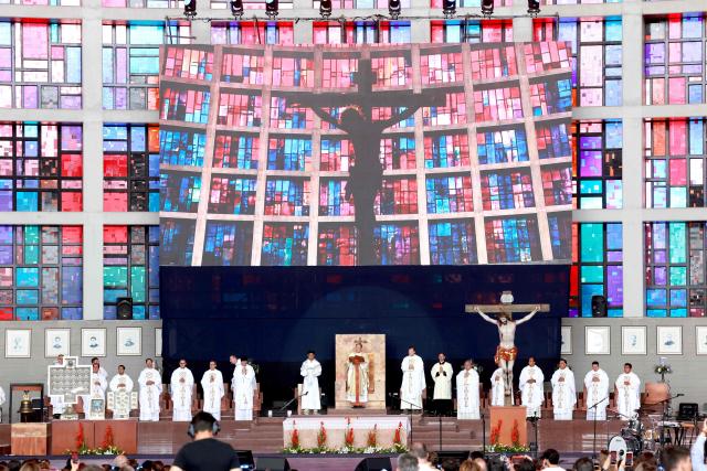 Priests celebrate a mass during the 2026 Fearless Congress at the Sanctuary of the Mexican Martyrs in Tlaquepaque, Jalisco state, Mexico on April 19, 2026. The Fearless Congress is hosted by conservative Catholics from Regnum Christi, a lay movement of the Legionaries of Christ, in response to the "attack on masculinity" that is growing in Mexico amid the rise of feminism, according to the event's organizers on their website. On April 16, 2026, feminist organizations protested against the event in front of the Ministry of the Interior, arguing that it spreads "hate speech" and highlighting the severe gender-based violence in Mexico. (Photo by Ulises RUIZ / AFP)