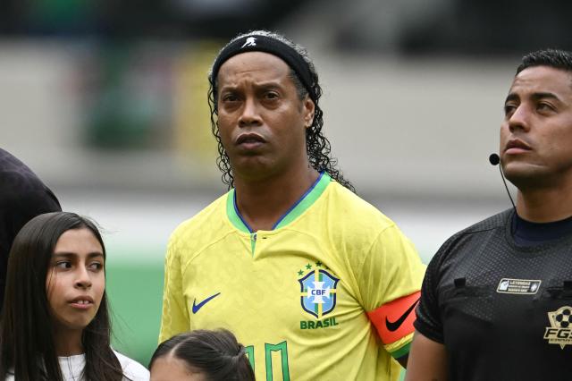 Brazilian former football player Ronaldinho looks on ahead of the legends exhibition football match between Mexico and Brazil at the Azteca Stadium in Mexico City on April 19, 2026. (Photo by CARL DE SOUZA / AFP)