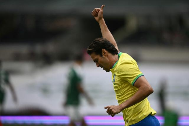 Brazilian former football player Kaka celebrates scoring a goal during the legends exhibition football match between Mexico and Brazil at the Azteca Stadium in Mexico City on April 19, 2026. (Photo by CARL DE SOUZA / AFP)