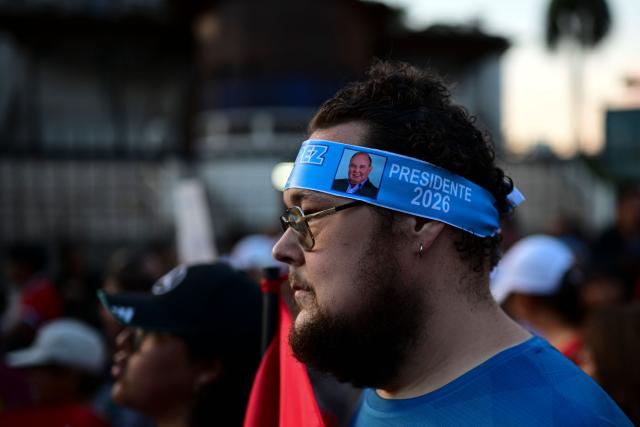 Supporters of ultra-conservative candidate Rafael Lopez Aliaga take part in a protest over alleged fraud following the results of the presidential election in Lima on April 19, 2026. (Photo by ERNESTO BENAVIDES / AFP)