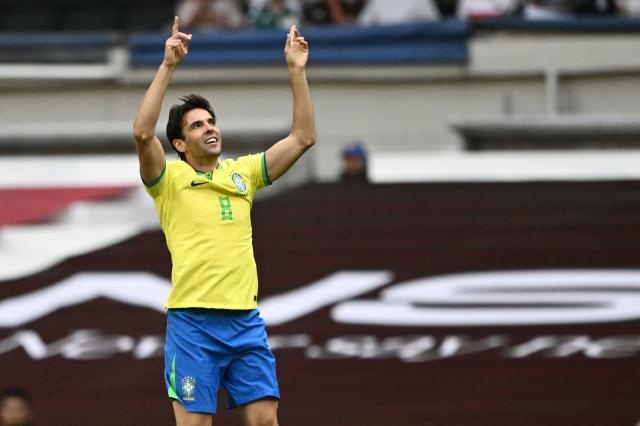Brazilian former football player Kaka celebrates scoring a goal during the legends exhibition football match between Mexico and Brazil at the Azteca Stadium in Mexico City on April 19, 2026. (Photo by CARL DE SOUZA / AFP)