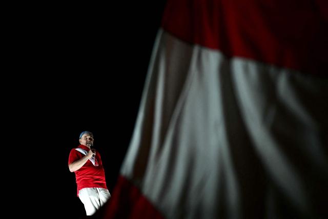 Peru's presidential candidate Rafael Lopez Aliaga speaks to supporters during a protest over alleged fraud following the results of the presidential election in Lima on April 19, 2026. (Photo by ERNESTO BENAVIDES / AFP)