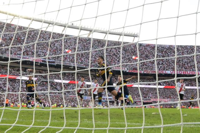 Boca Juniors' midfielder #05 Leandro Paredes celebrates scoring the opening goal during the Argentine Professional Football League 2026 Apertura Tournament match between River Plate and Boca Juniors at MAS Monumental stadium in Buenos Aires on April 19, 2026. (Photo by JUAN MABROMATA / AFP)