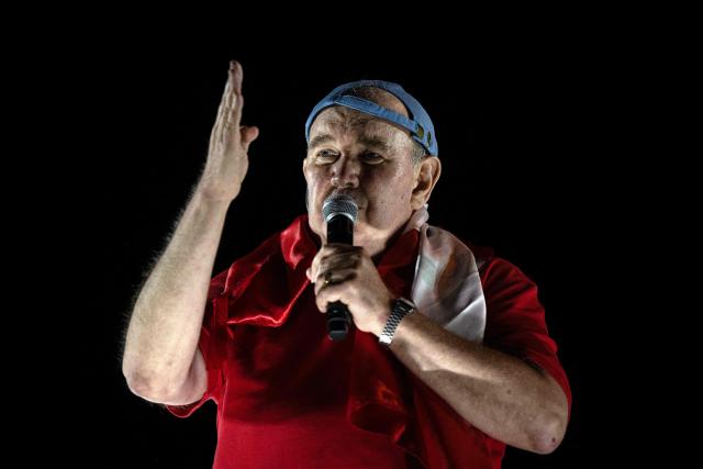 Peru's presidential candidate Rafael Lopez Aliaga speaks to supporters during a protest over alleged fraud following the results of the presidential election in Lima on April 19, 2026. (Photo by ERNESTO BENAVIDES / AFP)