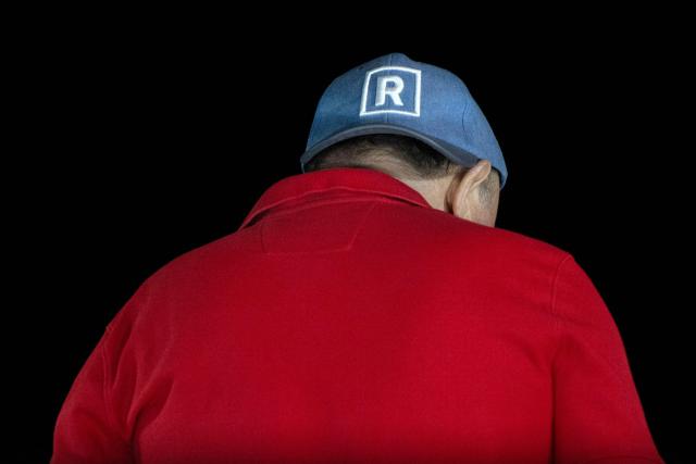 Peru's presidential candidate Rafael Lopez Aliaga wears a cap with the logo of the Renovacion Popular party during a protest over alleged fraud following the results of the presidential election in Lima on April 19, 2026. (Photo by ERNESTO BENAVIDES / AFP)