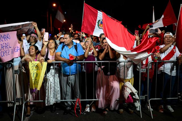 Supporters of Peru's presidential candidate Rafael Lopez Aliaga take part in a protest over alleged fraud following the results of the presidential election in Lima on April 19, 2026. (Photo by ERNESTO BENAVIDES / AFP)