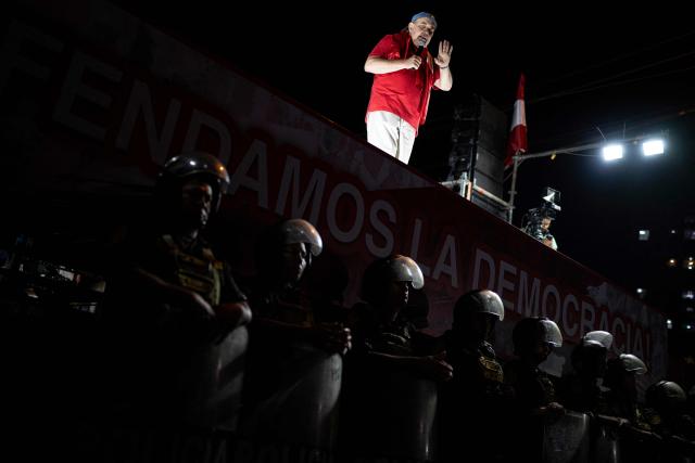 Peru's presidential candidate Rafael Lopez Aliaga speaks to supporters during a protest over alleged fraud following the results of the presidential election in Lima on April 19, 2026. (Photo by ERNESTO BENAVIDES / AFP)