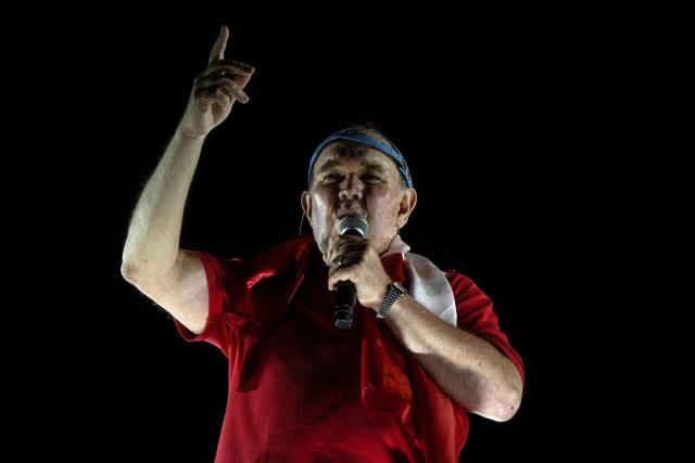 Peru's presidential candidate Rafael Lopez Aliaga speaks to supporters during a protest over alleged fraud following the results of the presidential election in Lima on April 19, 2026. (Photo by ERNESTO BENAVIDES / AFP)