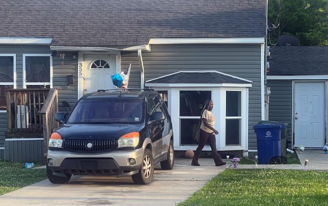 A woman is seen outside the house where a mass shooting took place in Shreveport, Louisiana, on April 19, 2026. Eight children were killed in a shooting spree early April 19 in the southern US state of Louisiana, in what police said appears to have been an incident of domestic violence. The incident, which took place just after 6:00 am (1100 GMT) in the city of Shreveport, was the deadliest mass shooting in the US in more than two years, according to data from the Gun Violence Archive. (Photo by Gianrigo MARLETTA / AFP)