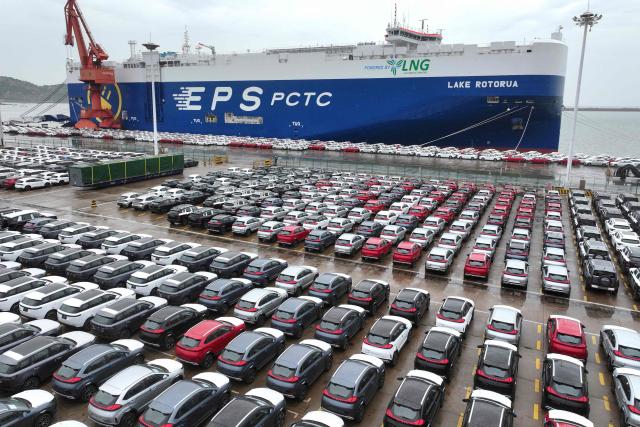 Chinese-made cars from brands including Chery and Jetour are seen before being loaded onto ships for export at the Dongfang Port Company terminal oin Lianyungang, in China’s eastern Jiangsu province on April 20, 2026. (Photo by CN-STR / AFP) / China OUT