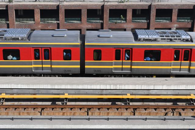 Commuters travel aboard a metro train in Lahore on April 20, 2026, as Pakistan government seeks to promote public transport in response to the global energy crisis triggered by the Middle East war. Oil prices surged on April 20, on a re-escalation of hostilities in the Middle East war after Iran closed the Strait of Hormuz at the weekend, just a day after reopening it, citing the United States' blockade of its ports. (Photo by Arif ALI / AFP)