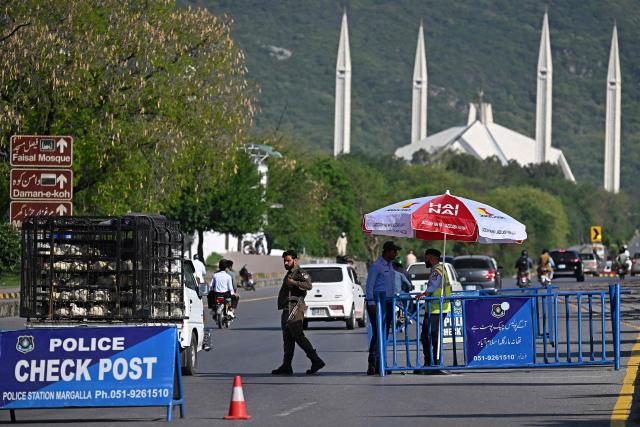 Security personnel stand guard at a security checkpost ahead of anticipated US-Iran peace talks in Islamabad on April 20, 2026. Iran is not currently planning to attend talks with the United States, state media said, after President Donald Trump ordered US negotiators to travel to Pakistan on April 20, just days before a ceasefire in the Middle East expires. (Photo by Aamir QURESHI / AFP)