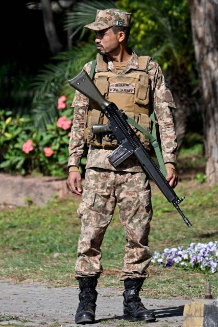 An army personnel stands guard at the Red Zone area ahead of anticipated US-Iran peace talks in Islamabad on April 20, 2026. Iran is not currently planning to attend talks with the United States, state media said, after President Donald Trump ordered US negotiators to travel to Pakistan on April 20, just days before a ceasefire in the Middle East expires. (Photo by Aamir QURESHI / AFP)