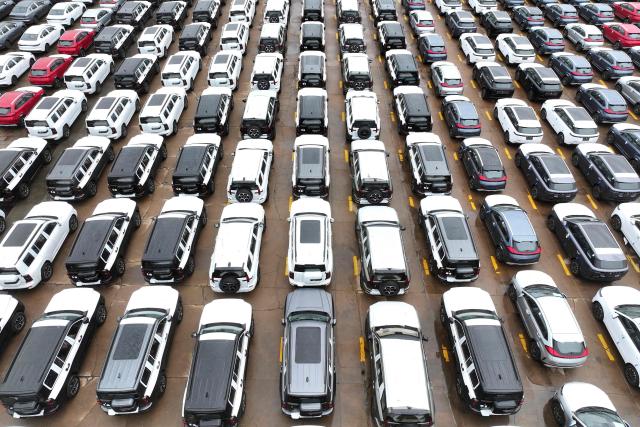 Chinese-made cars from brands including Chery and Jetour are seen before being loaded onto ships for export at the Dongfang Port Company terminal oin Lianyungang, in China’s eastern Jiangsu province on April 20, 2026. (Photo by CN-STR / AFP) / China OUT