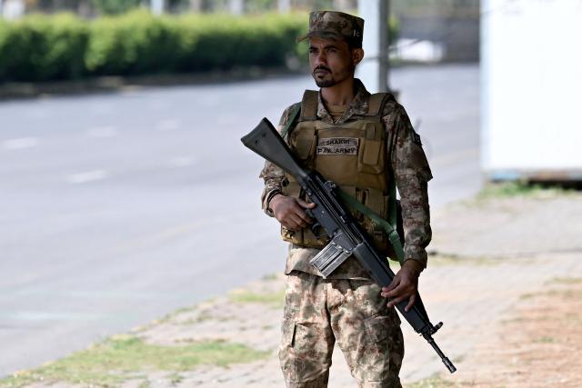 An army personnel stands guard at the Red Zone area ahead of anticipated US-Iran peace talks in Islamabad on April 20, 2026. Iran is not currently planning to attend talks with the United States, state media said, after President Donald Trump ordered US negotiators to travel to Pakistan on April 20, just days before a ceasefire in the Middle East expires. (Photo by Aamir QURESHI / AFP)