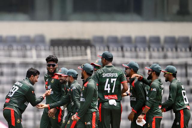 Bangladesh's Soumya Sarkar (L) celebrates with teammates after taking the wicket of New Zealand's captain Tom Latham during the second one-day international (ODI) cricket match between Bangladesh and New Zealand at Sher-e-Bangla National Stadium in Mirpur on April 20, 2026. (Photo by Munir UZ ZAMAN / AFP)
