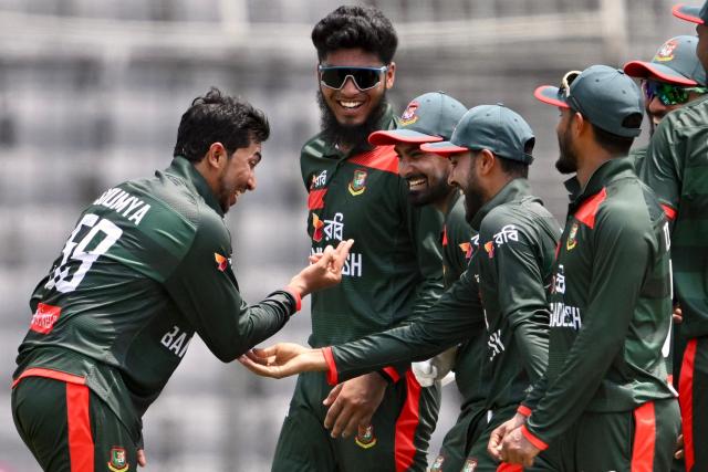 Bangladesh's Soumya Sarkar (L) celebrates with teammates after taking the wicket of New Zealand's captain Tom Latham during the second one-day international (ODI) cricket match between Bangladesh and New Zealand at Sher-e-Bangla National Stadium in Mirpur on April 20, 2026. (Photo by Munir UZ ZAMAN / AFP)