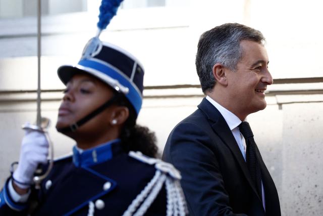 France's Justice Minister Gerald Darmanin (R) reacts as he arrives ahead of the 6th Ministerial Meeting of the European Coalition against Organized Crime at the Hotel de Beauveau, the French Interior Ministry, in Paris on April 20, 2026. (Photo by Kenzo TRIBOUILLARD / AFP)