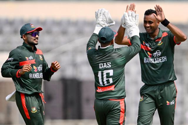 Bangladesh's Shoriful Islam (R) celebrates with Litton Das (C) and Najmul Hossain Shanto after taking the wicket of New Zealand's Nick Kelly during the second one-day international (ODI) cricket match between Bangladesh and New Zealand at Sher-e-Bangla National Stadium in Mirpur on April 20, 2026. (Photo by Munir UZ ZAMAN / AFP)
