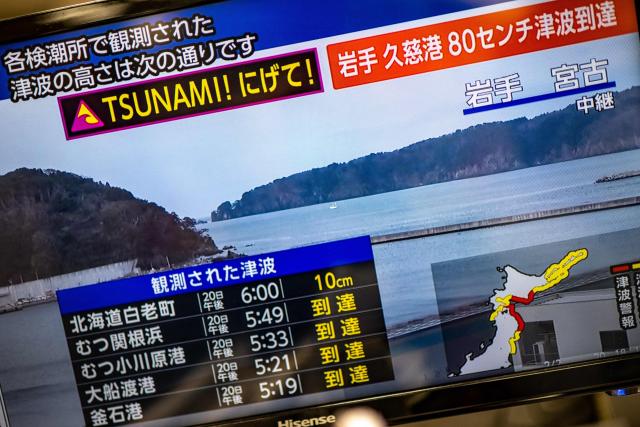 This photo shows a warning message on a screen from a live feed on NHK with tsunami alert after an earthquake hit northern Japan, in Tokyo on April 20, 2026. A 7.4-magnitude earthquake struck northern Japan on April 20, Japan's Meteorological Agency (JMA) said, issuing a tsunami warning for waves up to three metres (10 feet). (Photo by Philip FONG / AFP)