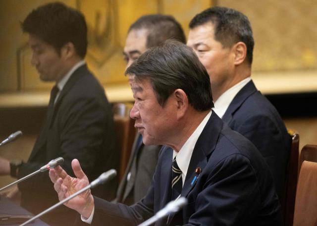 Japan's Foreign Minister Toshimitsu Motegi speaks during a meeting with Britain's Foreign Secretary Yvette Cooper at the Iikura Guest House in Tokyo on April 20, 2026. (Photo by ANDREW CABALLERO-REYNOLDS / AFP)