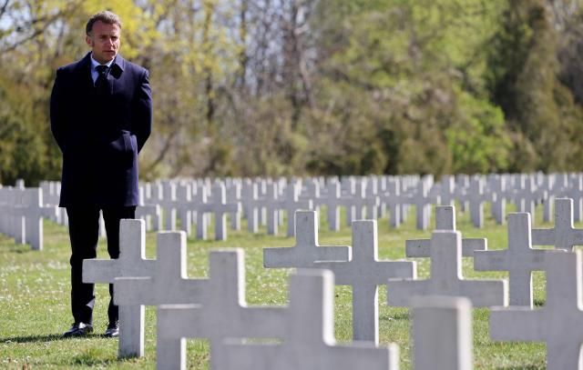 French President Emmanuel Macron stands at the French military cemetery in Gdansk at the start of his one-day-visit to Poland, on April 20, 2026. (Photo by Ludovic MARIN / AFP)