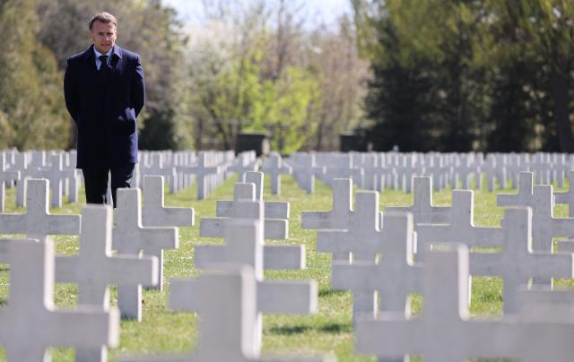 TOPSHOT - French President Emmanuel Macron stands at the French military cemetery in Gdansk at the start of his one-day-visit to Poland, on April 20, 2026. (Photo by Ludovic MARIN / AFP)
