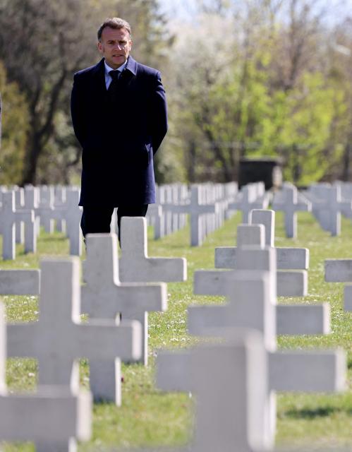 French President Emmanuel Macron stands at the French military cemetery in Gdansk at the start of his one-day-visit to Poland, on April 20, 2026. (Photo by Ludovic MARIN / AFP)