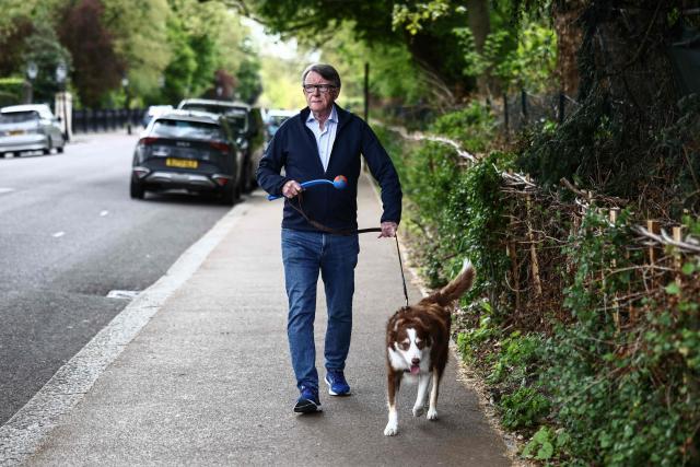 Former UK ambassador to the United States, Peter Mandelson, walks his dog near his residence in central London on April 20, 2026. Britain's embattled Prime Minister Keir Starmer will face lawmakers in parliament on April 20 as he bids to quell anger over an unrelenting scandal involving long-time Jeffrey Epstein associate Peter Mandelson. (Photo by Henry NICHOLLS / AFP)