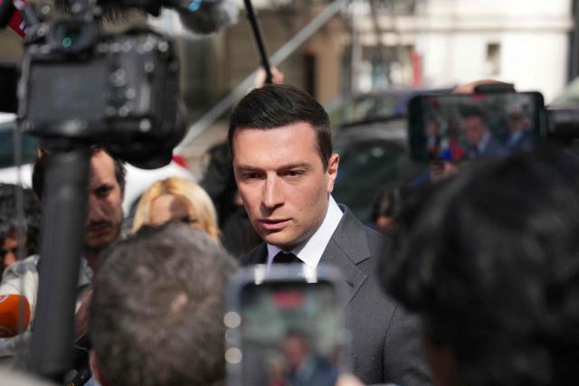 French far-right Rassemblement National RN party's President Jordan Bardella speaks to the press as he arrives for his lunch with French union Movement of the Enterprises of France (Medef) in Paris on April 20, 2026. (Photo by Dimitar DILKOFF / AFP)