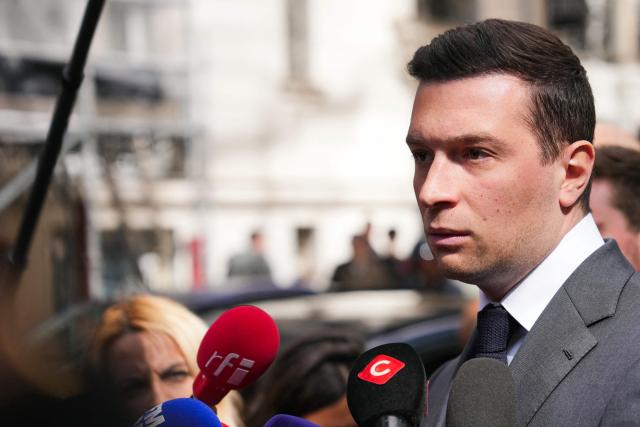 French far-right Rassemblement National RN party's President Jordan Bardella speaks to the press as he arrives for his lunch with French union Movement of the Enterprises of France (Medef) in Paris on April 20, 2026. (Photo by Dimitar DILKOFF / AFP)