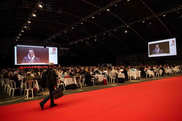 General secretary of the French labor union Force Ouvrière (FO) Frederic Souillot delivers a speech at the 26th national convention of the French labor union Force Ouvrière (FO) in Dijon, central-eastern France, on April 20, 2026. The secretary general of French labour union Force Ouvrière (FO), opened on April 20, 2026, the 26th congress of Frances third-largest trade union, which is being held in Dijon until Friday, by welcoming, to loud applause two of its recently released activists and former detainees in Iran. (Photo by ARNAUD FINISTRE / AFP)