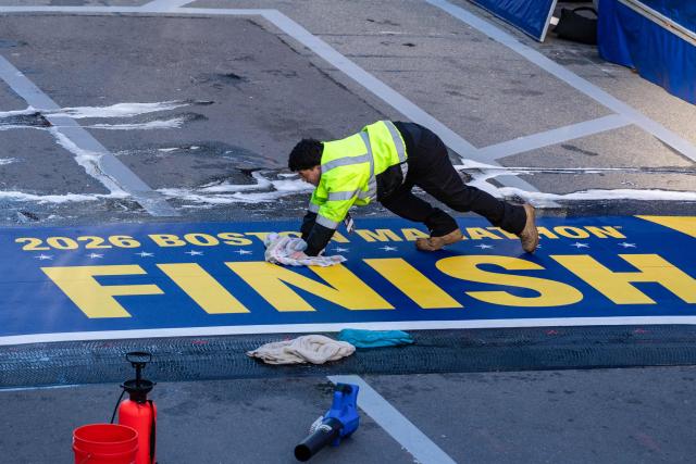 Workers prepare the finish line before the start of the 130th Boston Marathon on April 20, 2026, in Boston, Massachusetts. (Photo by Joseph Prezioso / AFP)