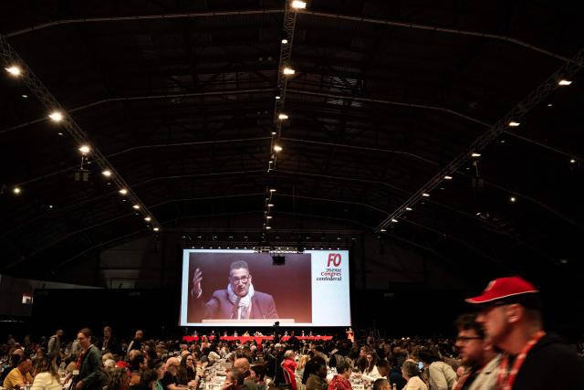 General secretary of the French labor union Force Ouvrière (FO) Frederic Souillot delivers a speech at the 26th national convention of the French labor union Force Ouvrière (FO) in Dijon, central-eastern France, on April 20, 2026. The secretary general of French labour union Force Ouvrière (FO), opened on April 20, 2026, the 26th congress of Frances third-largest trade union, which is being held in Dijon until April 24, 2026, by welcoming, to loud applause two of its recently released activists and former detainees in Iran. (Photo by ARNAUD FINISTRE / AFP)