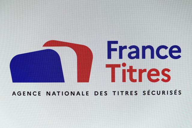 This photograph shows the logo of France Titres - Agence Nationale des Titres Securises ANTS (France's National Agency for Secure Documents) displayed on a screen in Paris on April 20, 2026. The National Agency for Secure Documents (ANTS), which processes applications for identity documents, "detected a security incident" on April 15, 2026, that may involve the personal data of individuals and businesses, the Home Office said in a statement on April 20, 2026. (Photo by Charlotte SIEMON / AFP)