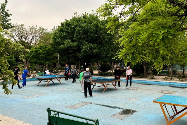 People play table tennis in a park in Tehran on April 20, 2026, amid a ceasefire that came into effect last week. Iran insisted it has no plan to attend a new round of negotiations with the United States on April 20, as uncertainty grows over a push to stop the Middle East war from resuming. US President Donald Trump said he was sending negotiators to Pakistan for talks on ending the war that engulfed the region and rattled global markets, while repeating threats to attack Iran's energy infrastructure if it did not make a deal. (Photo by AFP)