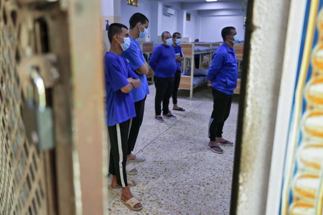 Patients stand in their dormitories the Al-Rusafa Center for Drug Rehabilitation and Treatment in Baghdad on April 20, 2026. Iraq, which borders Syria, Iran, Saudi Arabia, and Kuwait, is a transit country for drug smuggling and has become a major corridor for the drug trade in recent years, particularly for Captagon and crystal meth. Baghdad regularly announces the seizure of large quantities of narcotics, most notably Captagon, for which Saudi Arabia is the primary destination. (Photo by AHMAD AL-RUBAYE / AFP)