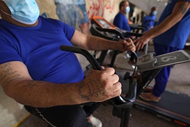 Patients exercise at the Al-Rusafa Center for Drug Rehabilitation and Treatment in Baghdad on April 20, 2026. Iraq, which borders Syria, Iran, Saudi Arabia, and Kuwait, is a transit country for drug smuggling and has become a major corridor for the drug trade in recent years, particularly for Captagon and crystal meth. Baghdad regularly announces the seizure of large quantities of narcotics, most notably Captagon, for which Saudi Arabia is the primary destination. (Photo by AHMAD AL-RUBAYE / AFP)